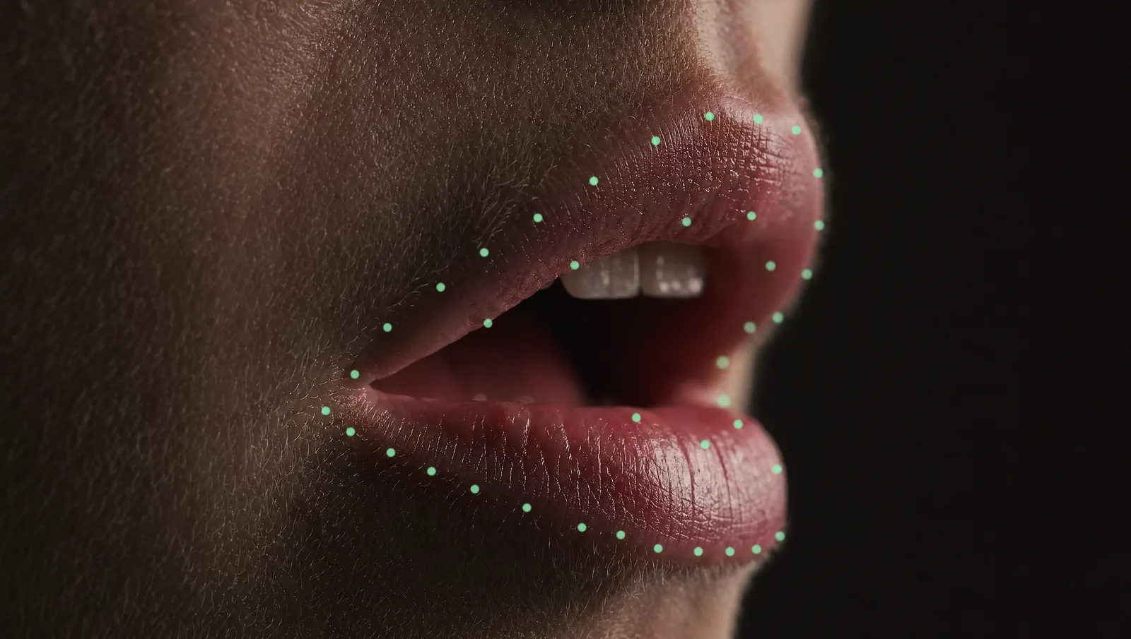 Macro of lips with mint tracking dots for lipsync